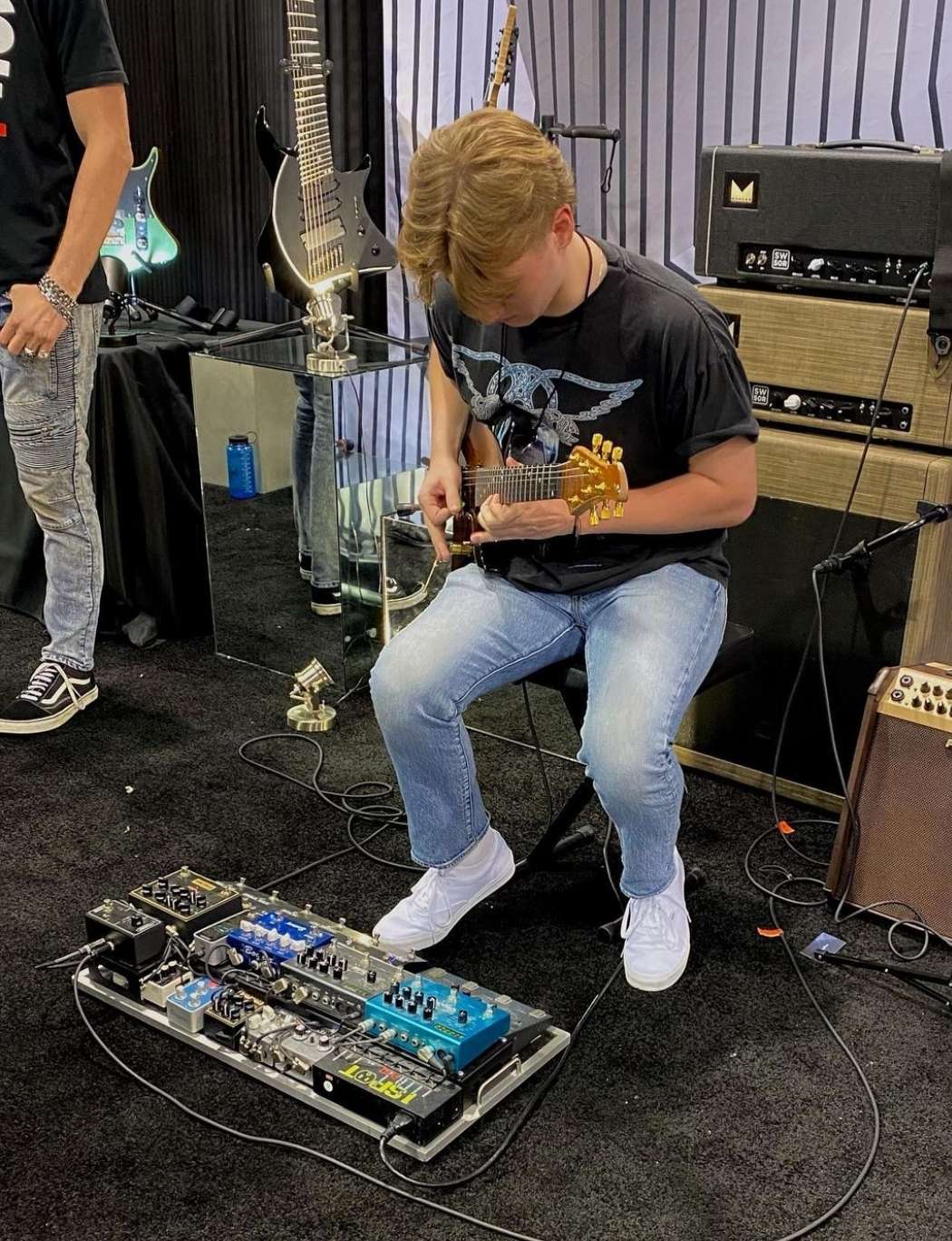 Playing guitar at an expo