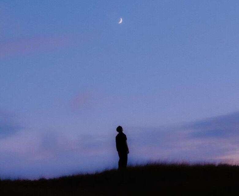 Looking up at a crescent moon